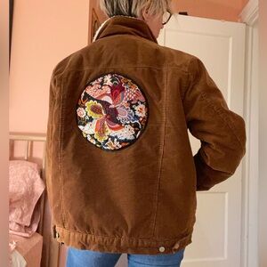 Vintage Sherpa-lined corduroy coat with patch detail. Approx women’s S oversized